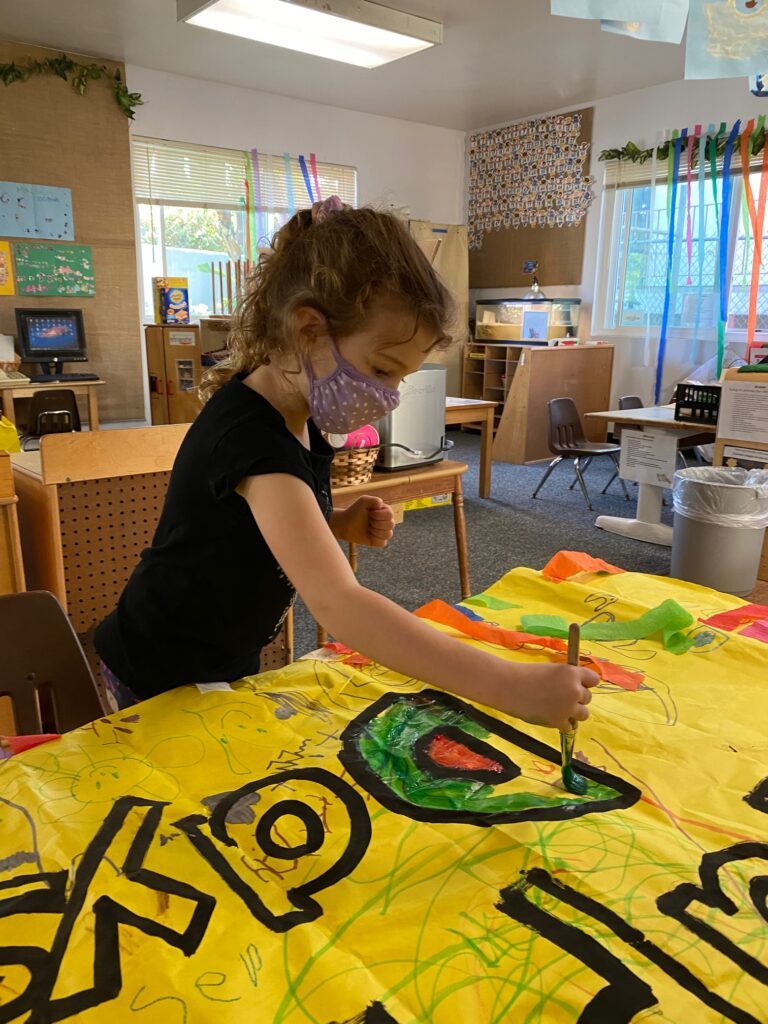 Painting preschool poster for 100 days celebration