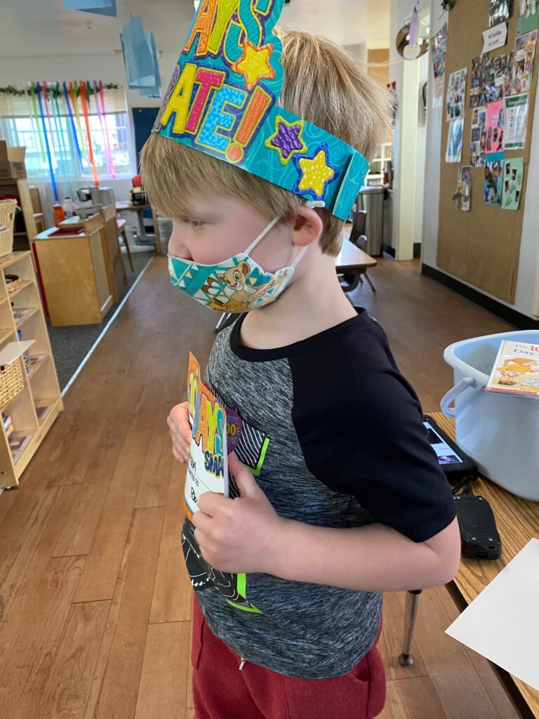 ceremony with certificate, hat, and sticker to celebrate